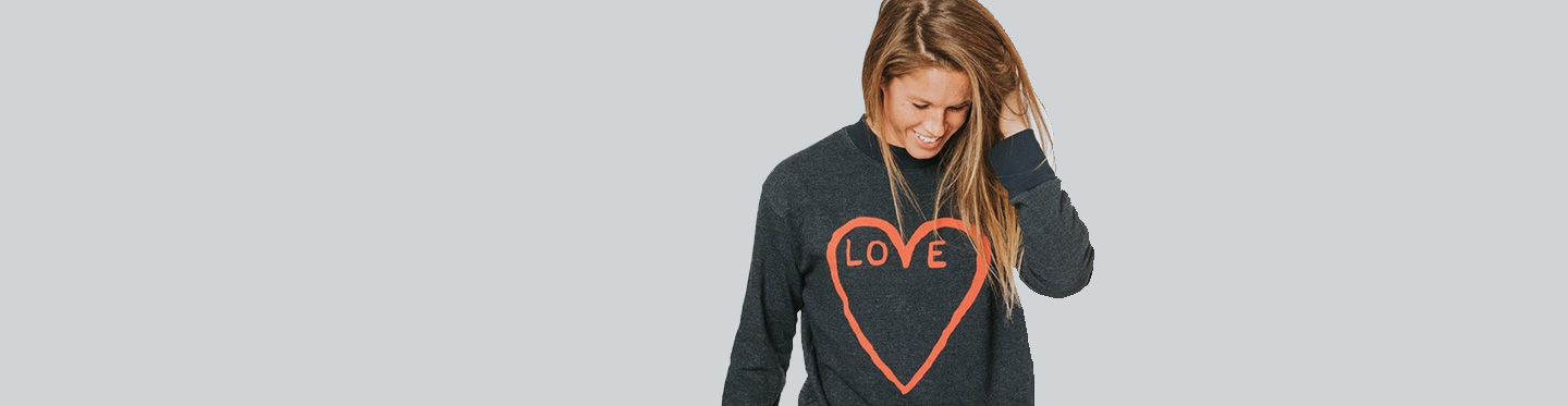 Crystal Seaver in a gray sweater that says love inside of a heart