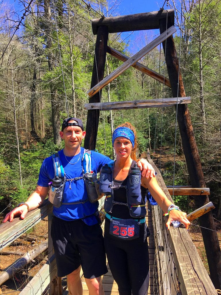 Crystal and Jess on a bridge while running the Georgia Death Race